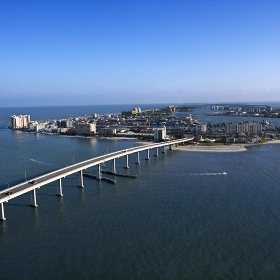 Aerial view of Clearwater coastal city with white sandy beaches, turquoise waters, and vibrant urban development - Perfect backdrop for understanding the pros and cons of living in Clearwater, Florida