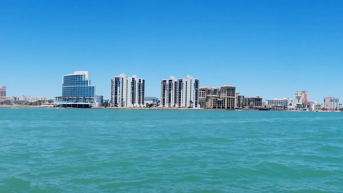 Clearwater Florida coastal lifestyle scene with waterfront condos and blue Gulf water
